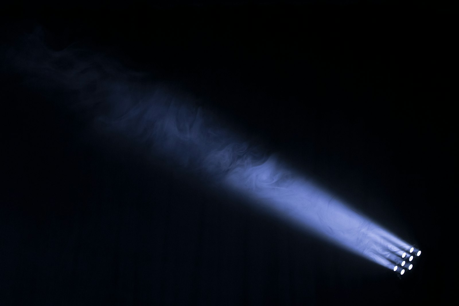 Stage spotlight shining in the dark